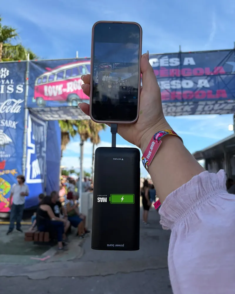 Love to Rock festival: a MasBattery power bank charging a phone at the entrance.